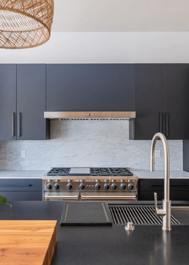 Dark grey kitchen cabinets and dark quartz countertop