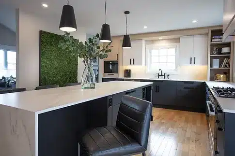 a kitchen with a center island with two chairs