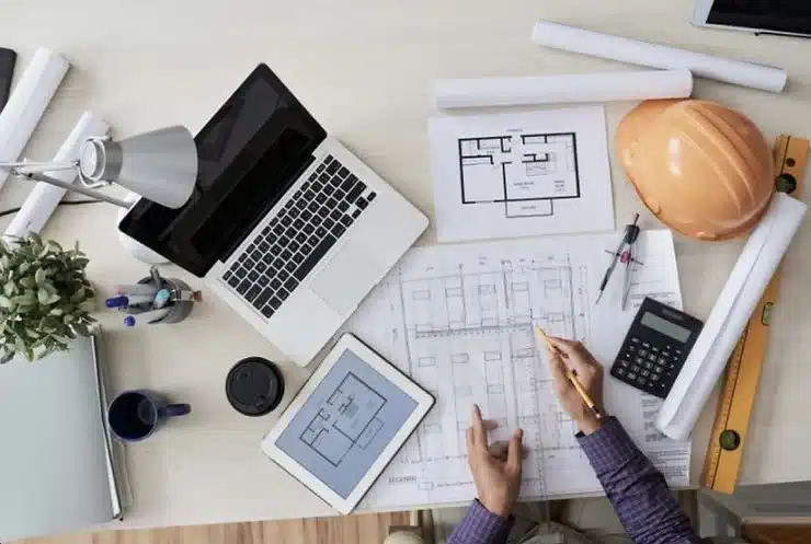 a person sitting at a desk working on a project