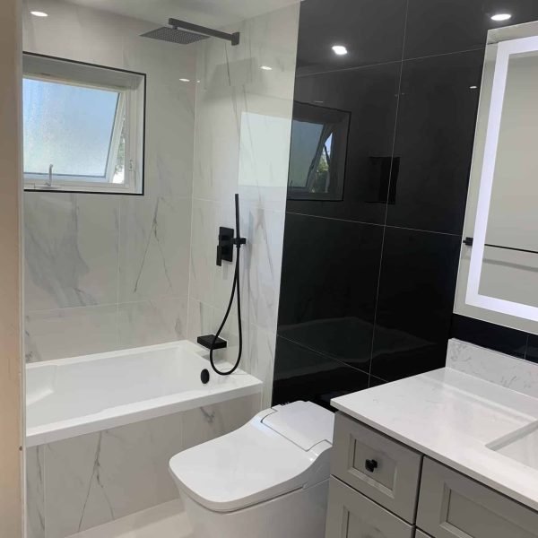 Renovated bathroom with deep soaking tub and custom cabinetry