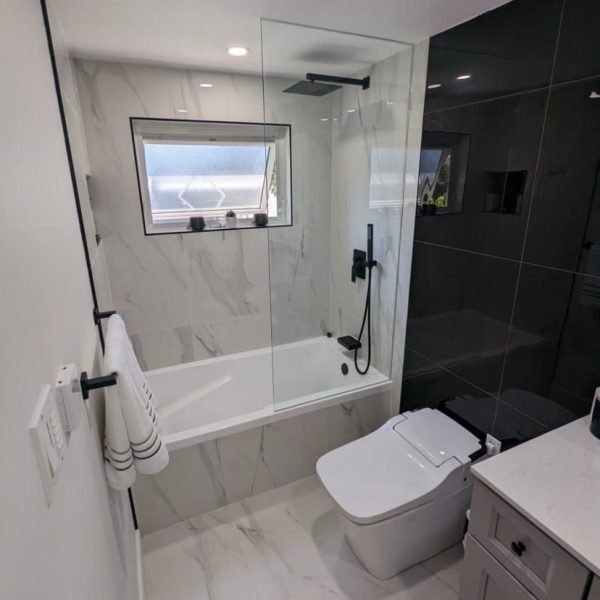 Updated bathroom with stylish fixtures and modern smart toilet