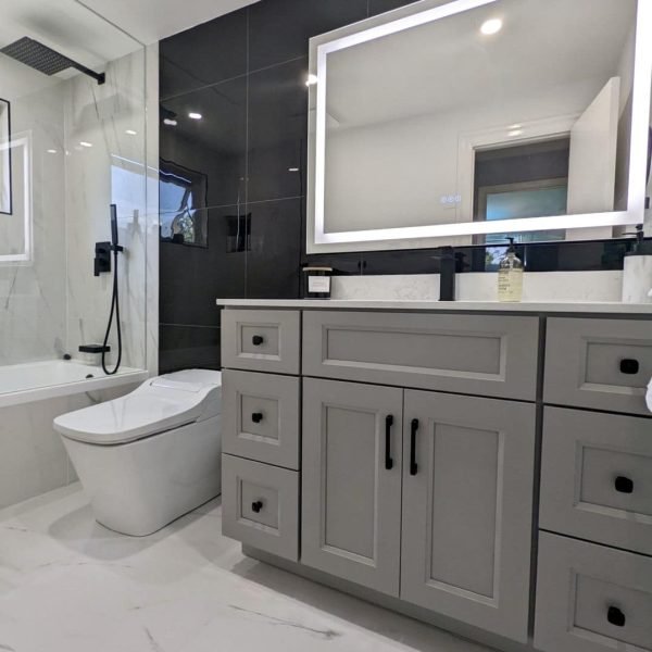 Grey custom vanity with black vanity wall tile