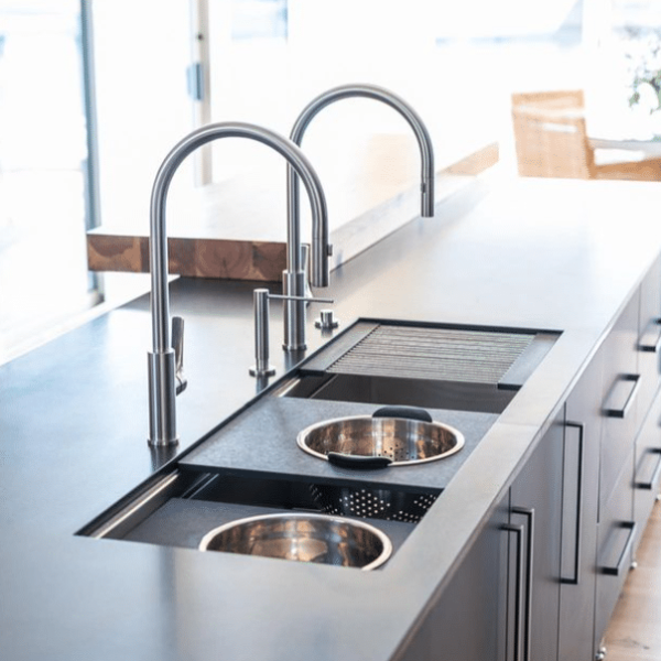 glossy black island with double sink on top