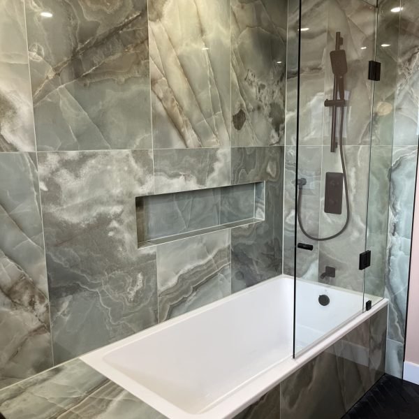 Modern bathroom with drop-in tub and bathtub niche