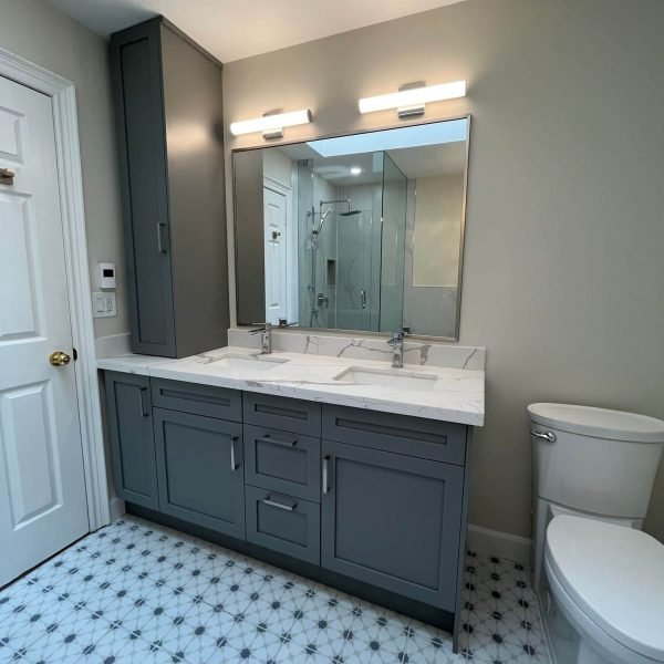 Grey custom vanity with with white quartz countertop
