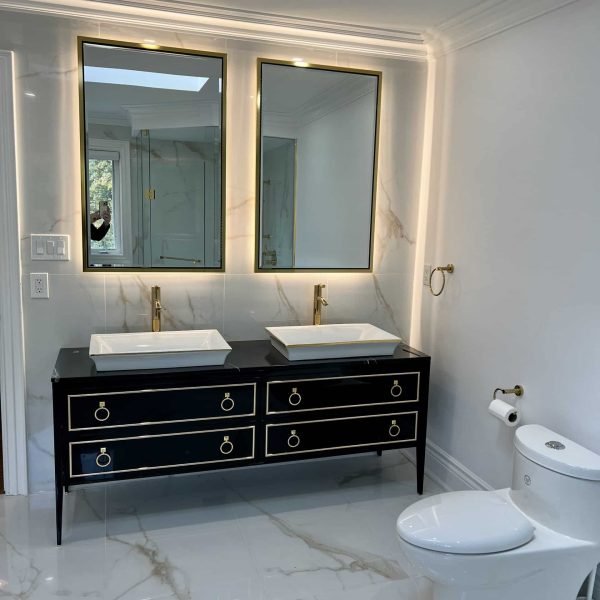 double sink vanity with marble gold tiles